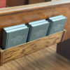 Six The Good Old Songs hymnals in the back of a pew